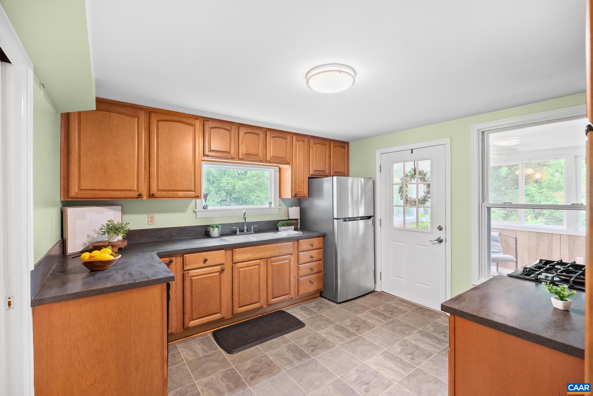 687 Gidsville Road Amherst, VA 24521 - Photo 20 of 70 a kitchen with stainless steel appliances granite countertop a refrigerator sink and cabinets