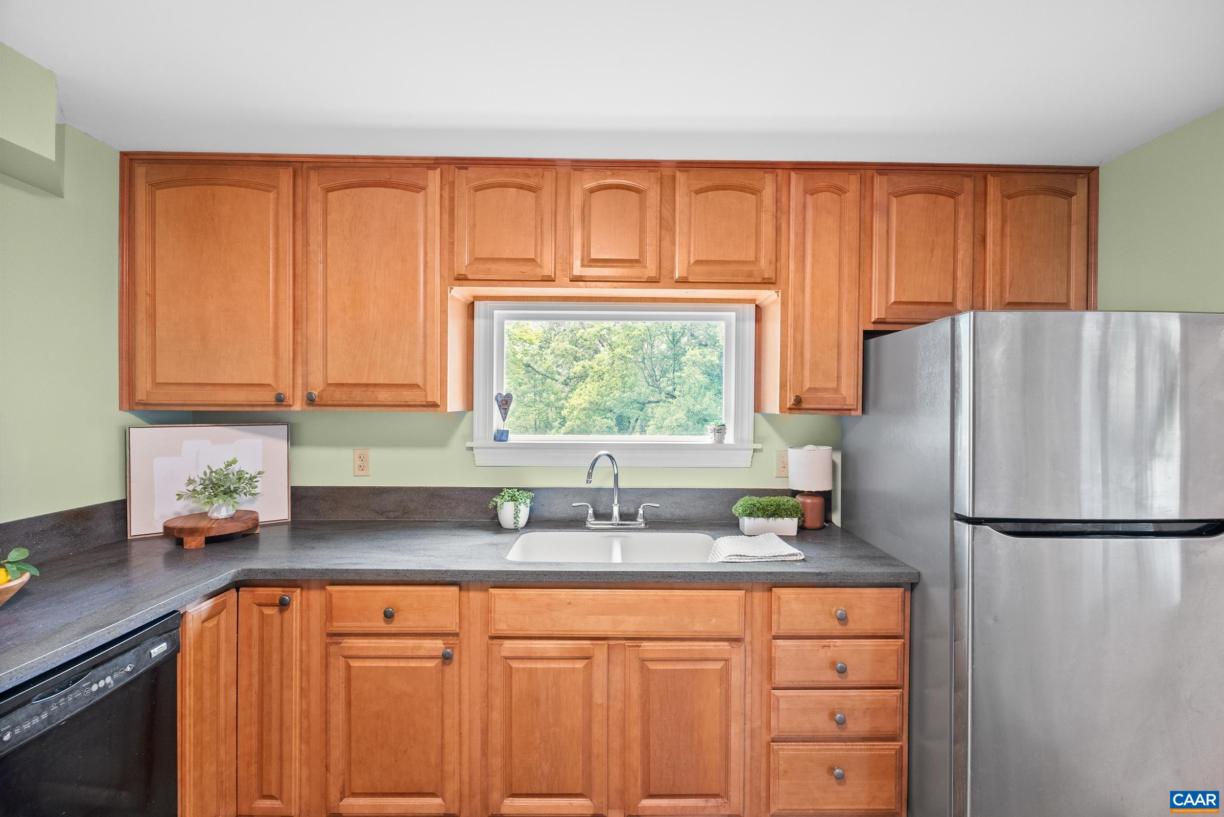 687 Gidsville Road Amherst, VA 24521 - Photo 21 of 70 a kitchen with stainless steel appliances granite countertop a refrigerator sink and cabinets