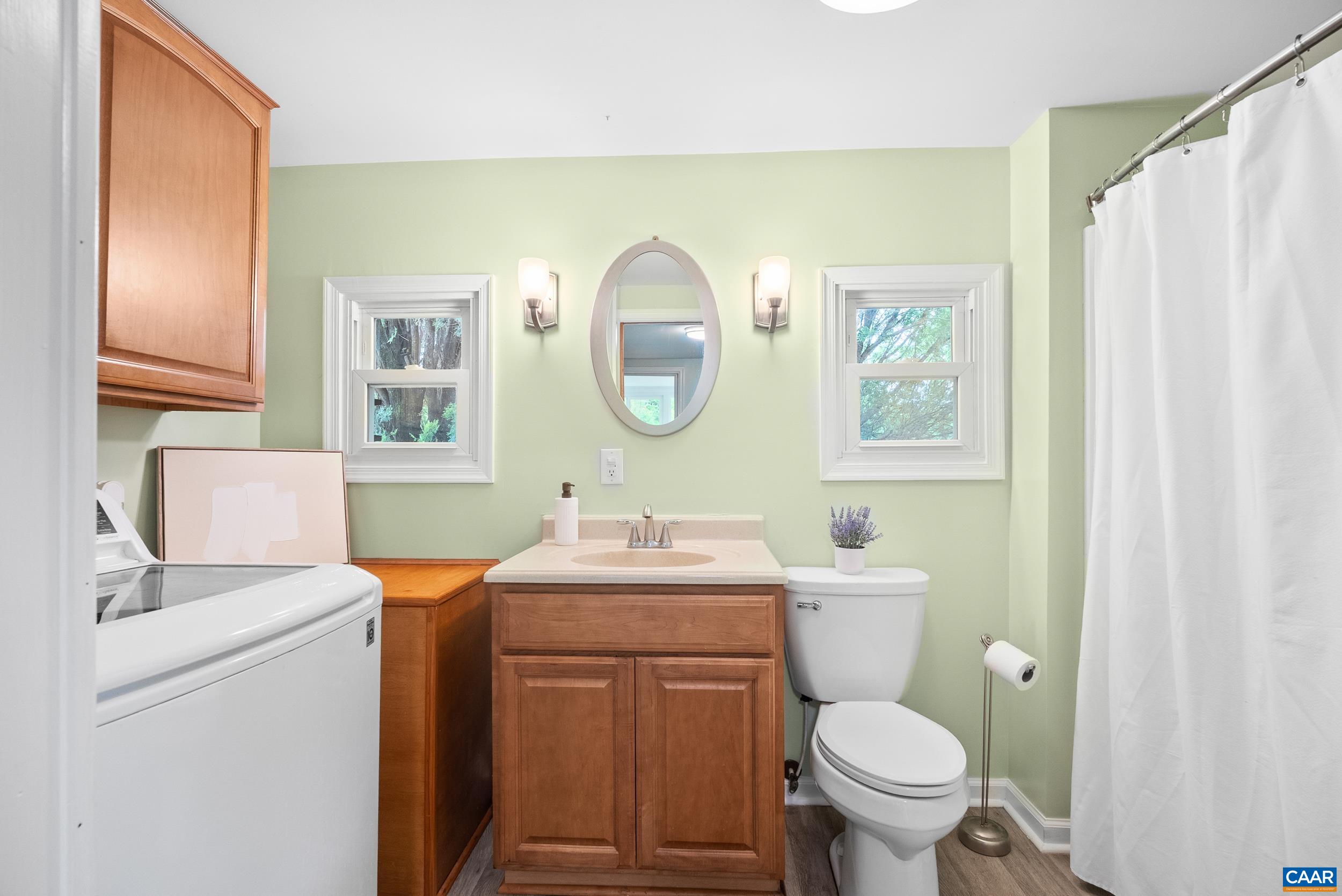 687 Gidsville Road Amherst, VA 24521 - Photo 26 of 70 a bathroom with a toilet sink vanity and mirror