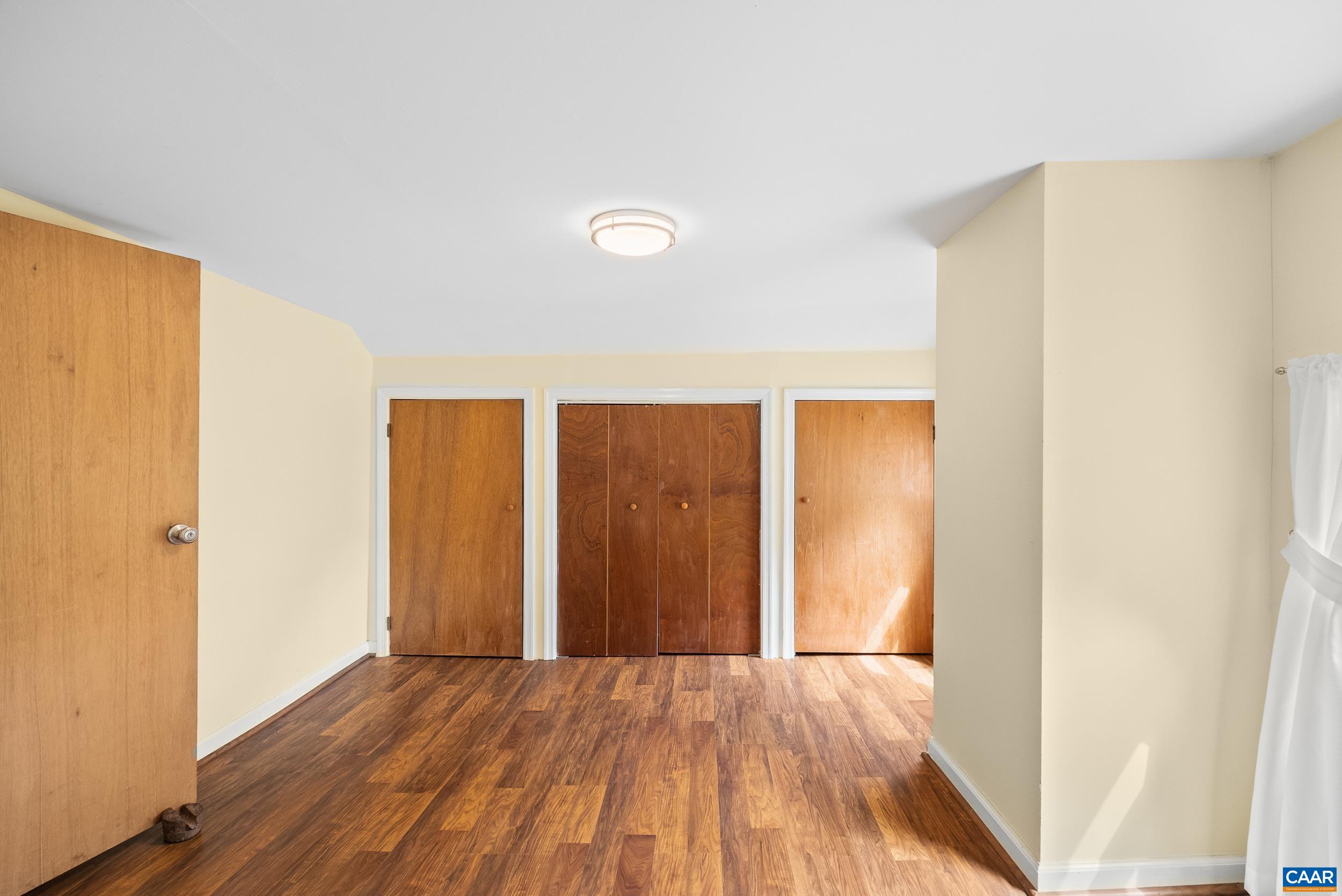 687 Gidsville Road Amherst, VA 24521 - Photo 32 of 70 a view of an empty room with wooden floor