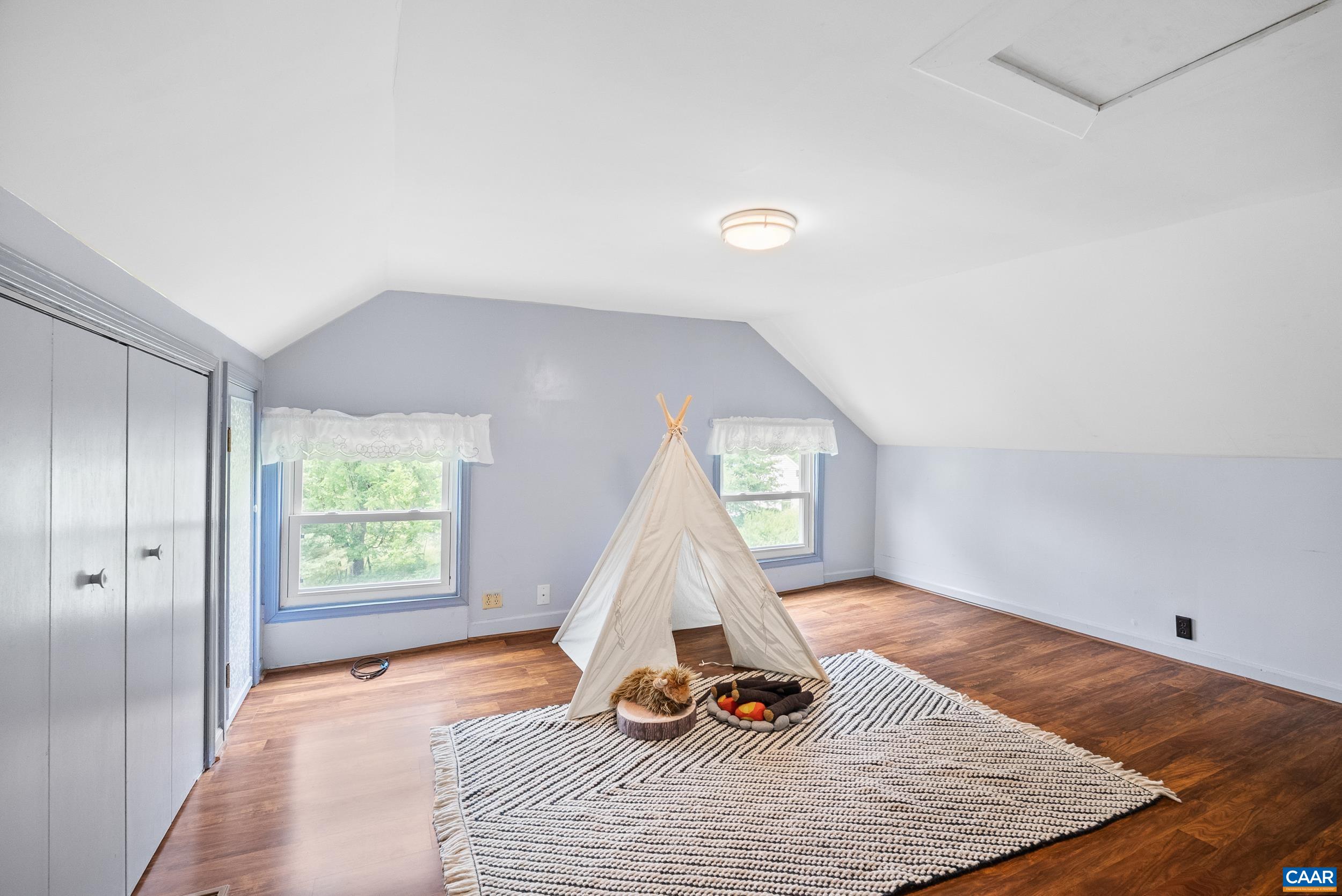 687 Gidsville Road Amherst, VA 24521 - Photo 33 of 70 a view of a bedroom with wooden floor and windows