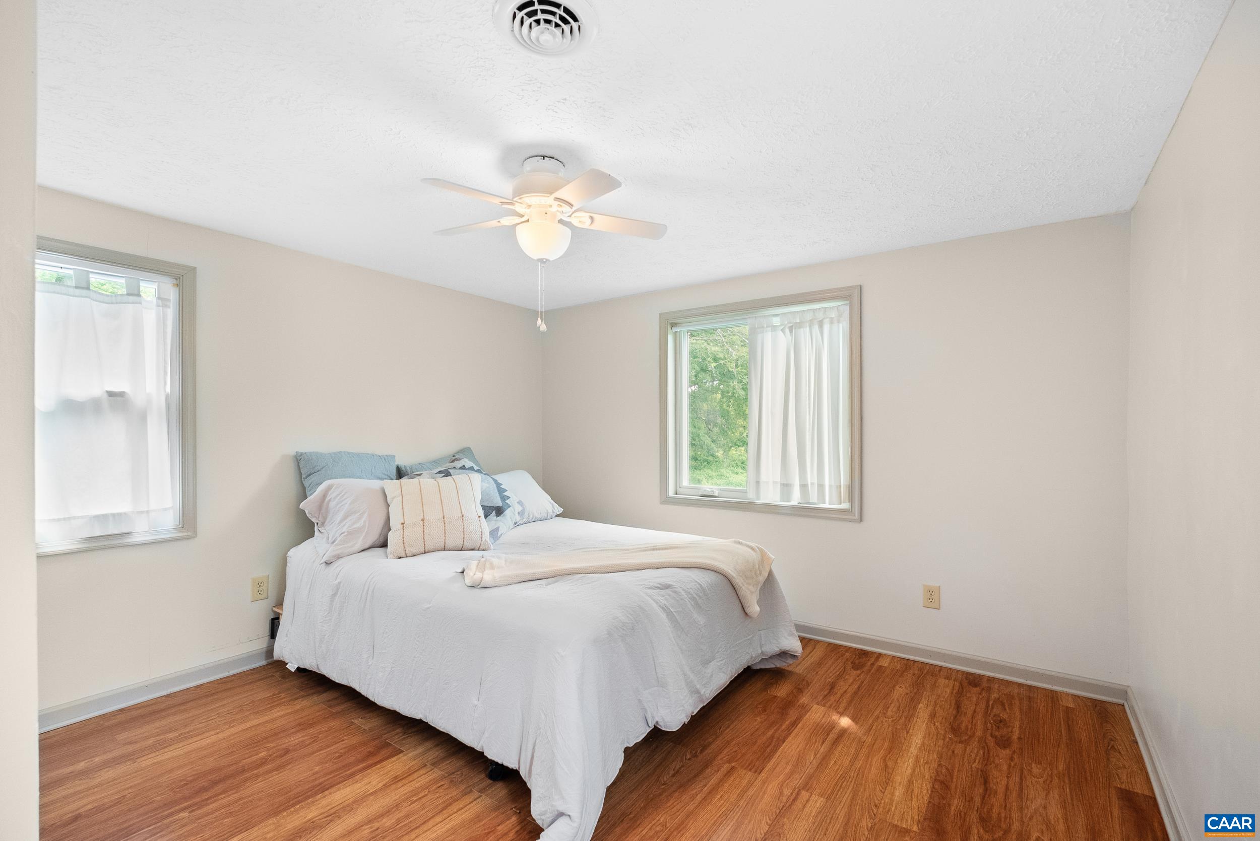 687 Gidsville Road Amherst, VA 24521 - Photo 38 of 70 a bedroom with a bed and wooden floor
