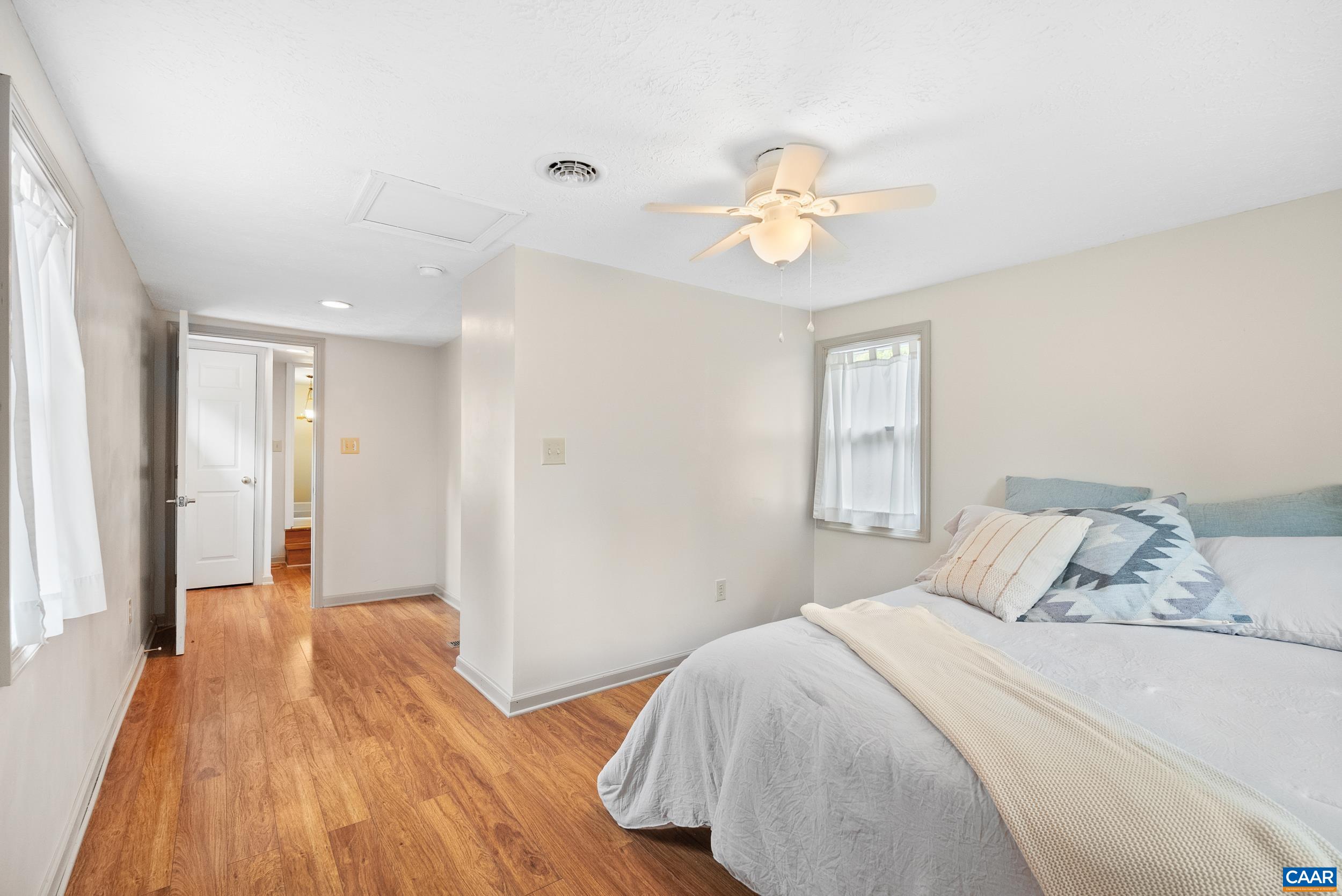 687 Gidsville Road Amherst, VA 24521 - Photo 39 of 70 a bedroom with a bed and a chandelier