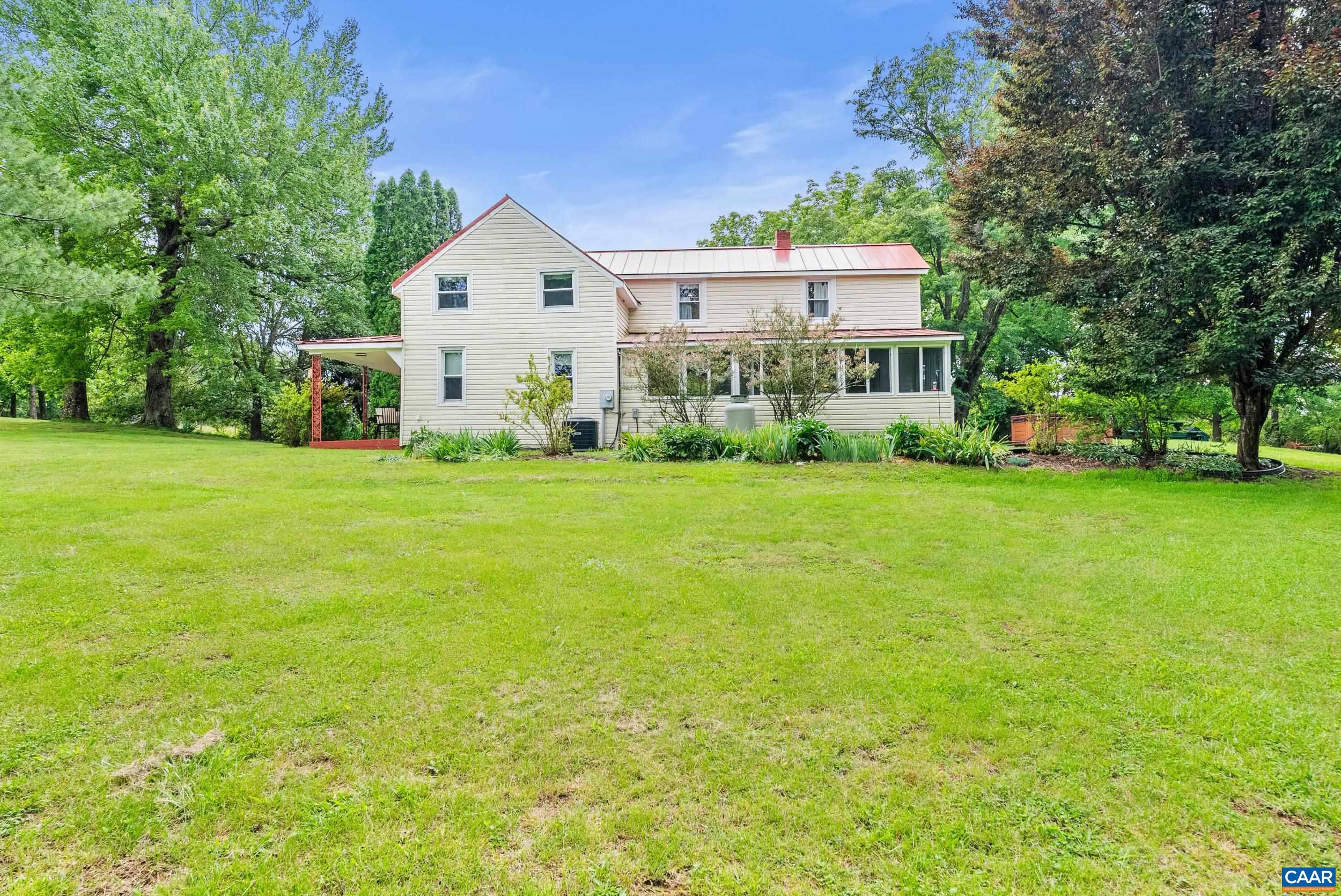 687 Gidsville Road Amherst, VA 24521 - Photo 7 of 70 a view of a house with a big yard and large trees