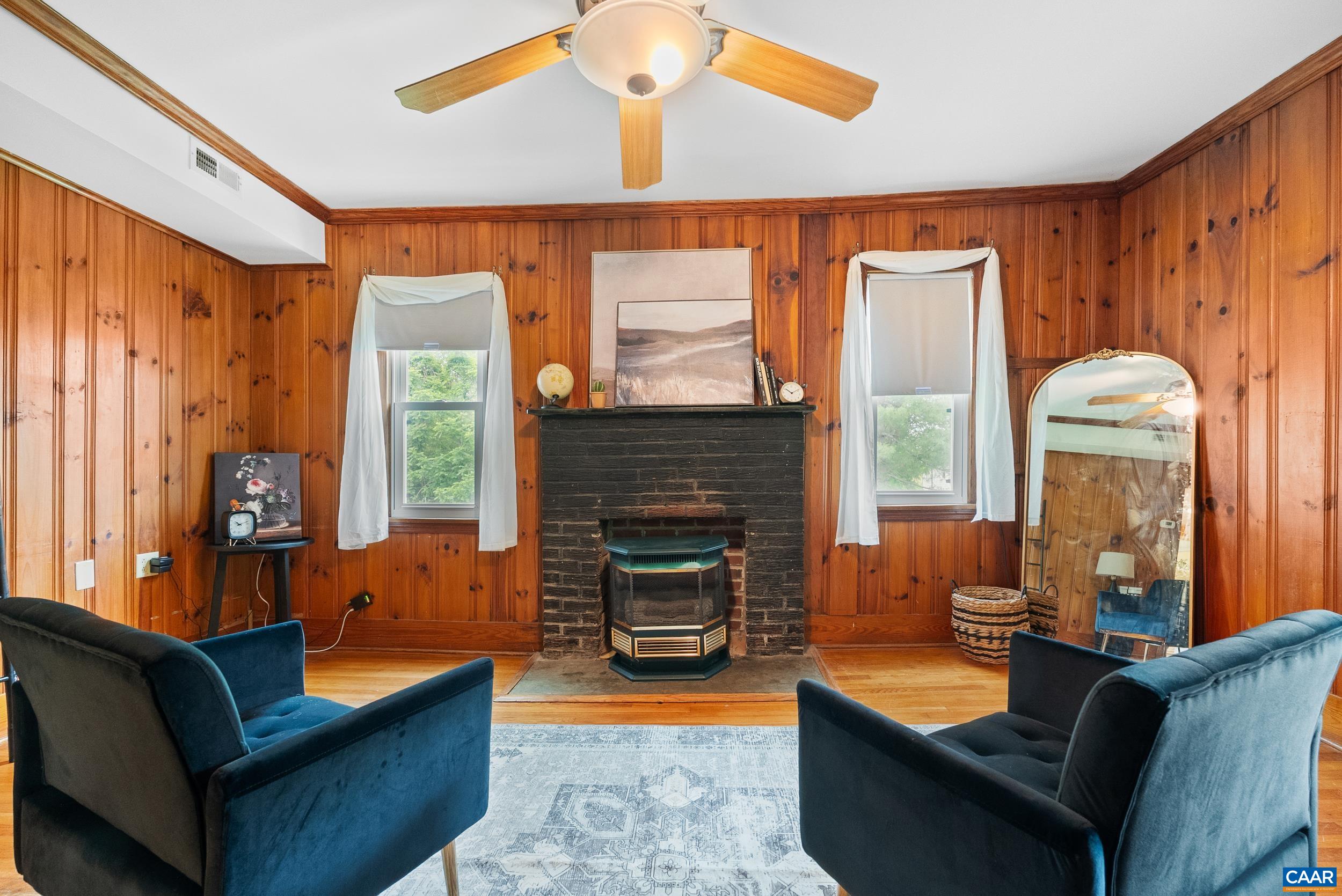 687 Gidsville Road Amherst, VA 24521 - Photo 10 of 70 a living room with furniture a fireplace and a large window