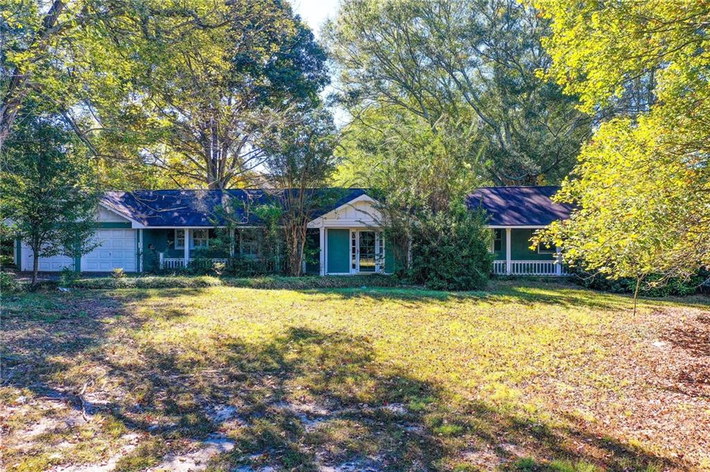1395 Mid Broadwell Road Alpharetta, GA 30004 - Photo 2 of 67 a front view of a house with a yard