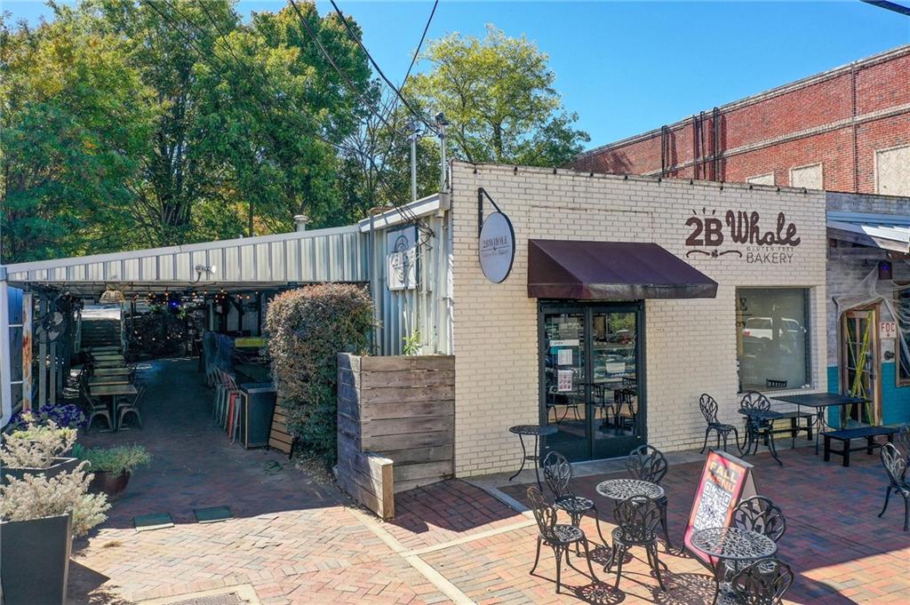1395 Mid Broadwell Road Alpharetta, GA 30004 - Photo 28 of 67 a view of a patio with table and chairs and potted plants