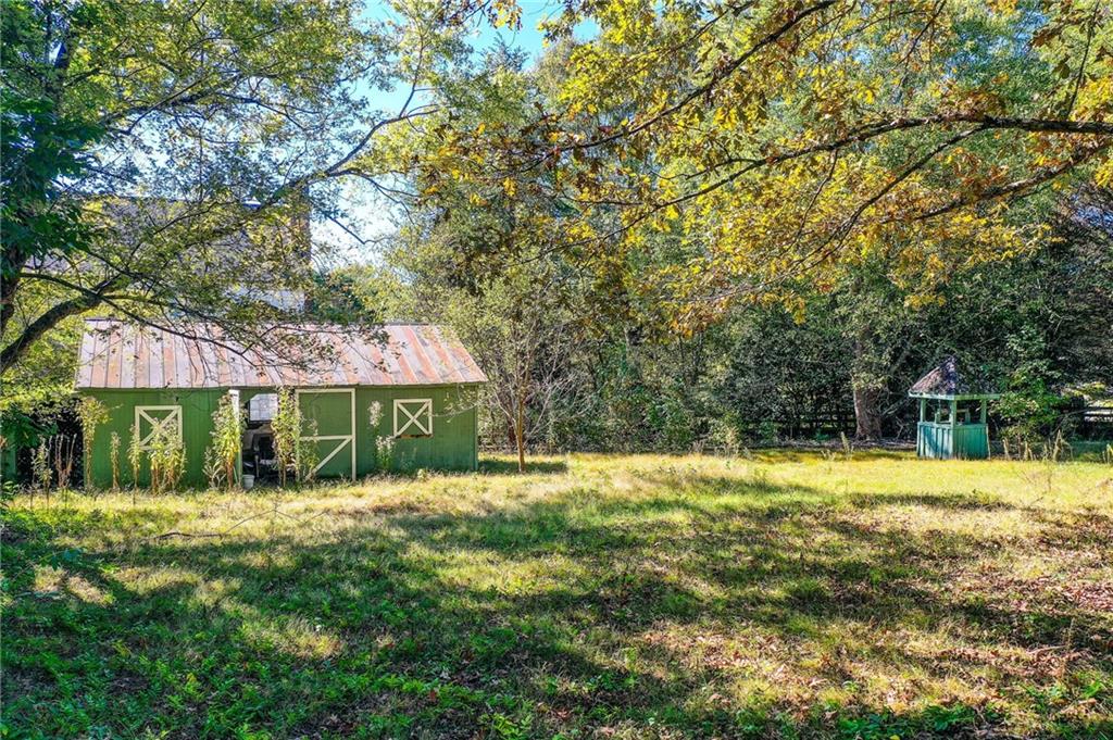 1395 Mid Broadwell Road Alpharetta, GA 30004 - Photo 4 of 67 a view of a house with a yard