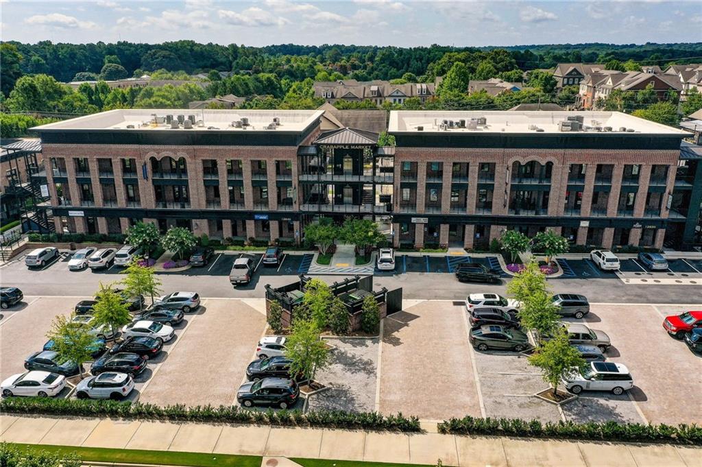 1395 Mid Broadwell Road Alpharetta, GA 30004 - Photo 51 of 67 a view of a patio with table and chairs potted plants and large tree