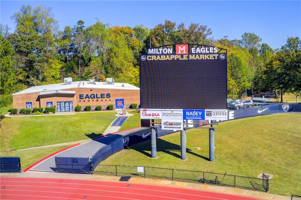 1395 Mid Broadwell Road Alpharetta, GA 30004 - Photo 65 of 67 a view of an chairs and tables in the patio