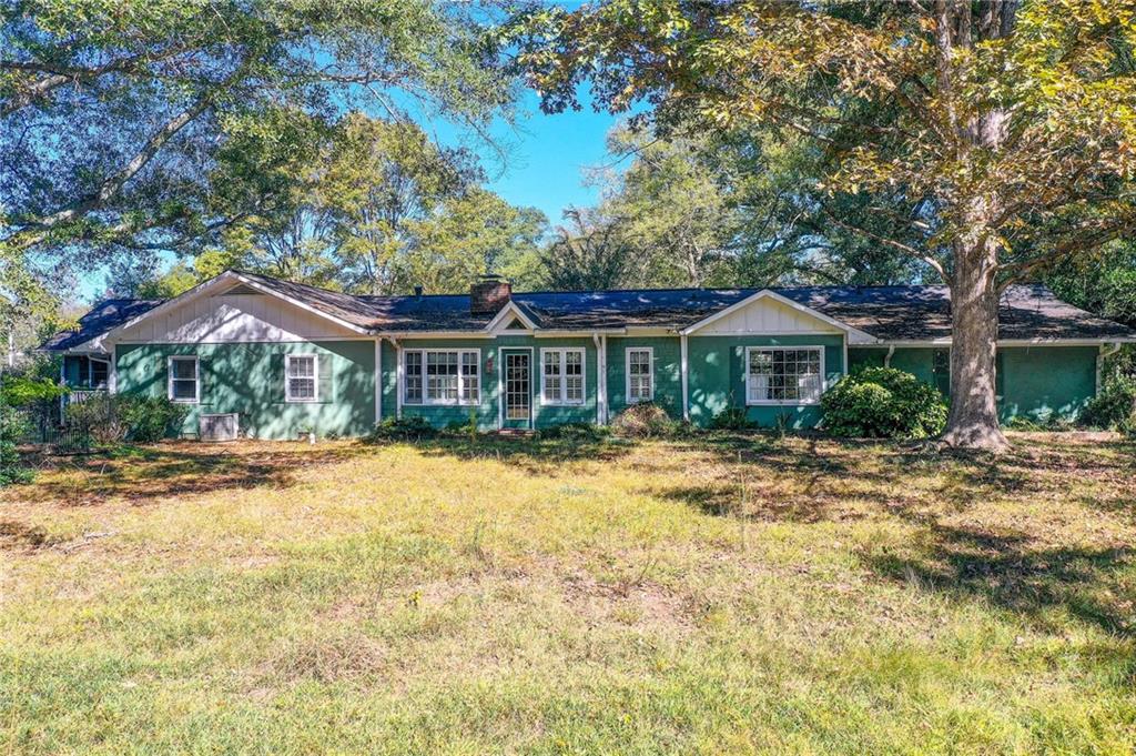1395 Mid Broadwell Road Alpharetta, GA 30004 - Photo 7 of 67 a front view of house with yard