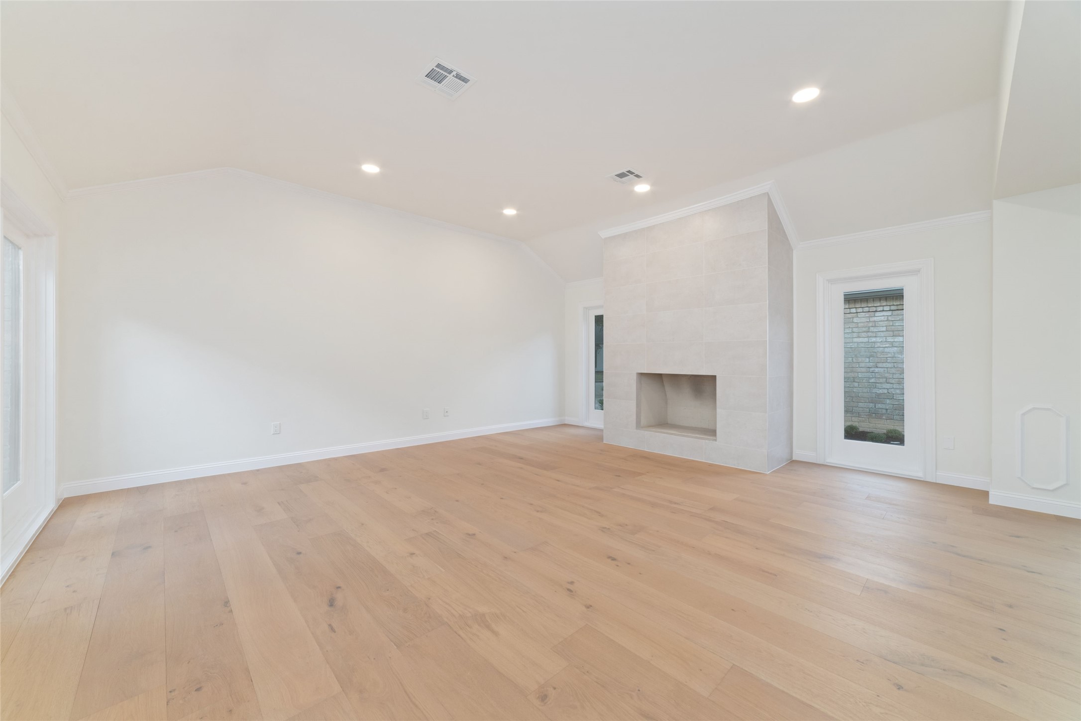 15651 Whitewater Lane Houston, TX 77079 - Photo 3 of 24 a view of an empty room with a fireplace