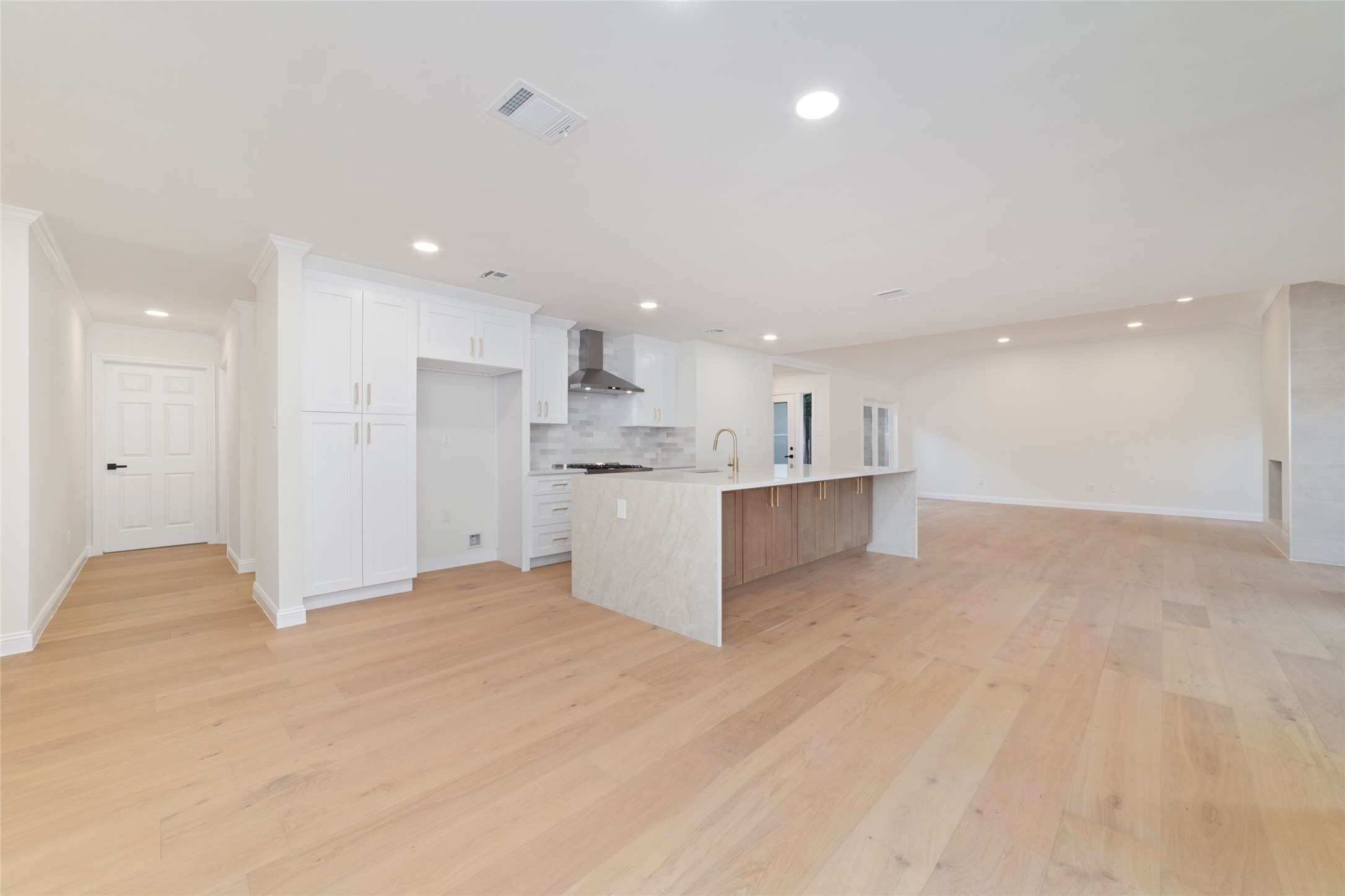 15651 Whitewater Lane Houston, TX 77079 - Photo 6 of 24 a view of kitchen with kitchen island white cabinets and refrigerator