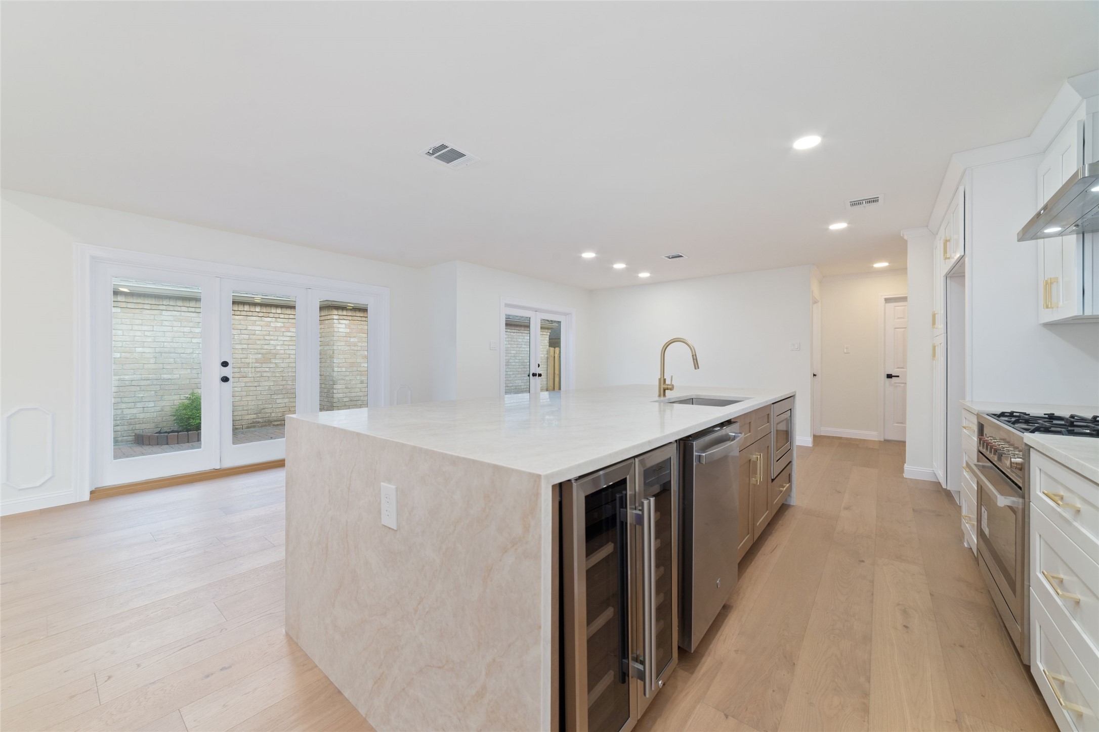 15651 Whitewater Lane Houston, TX 77079 - Photo 9 of 24 a kitchen with a sink and a refrigerator