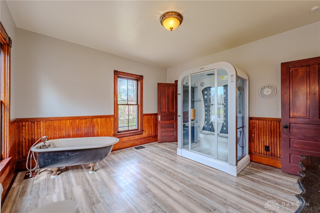 308 Yankee Road Middletown, OH 45044 - Photo 26 of 47 This spacious bathroom offers a relaxing soaking tub and a contemporary glass-enclosed shower.
