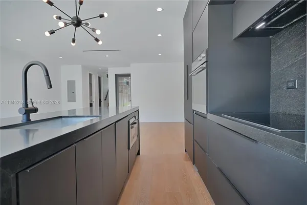 a view of a double vanity sink and a window