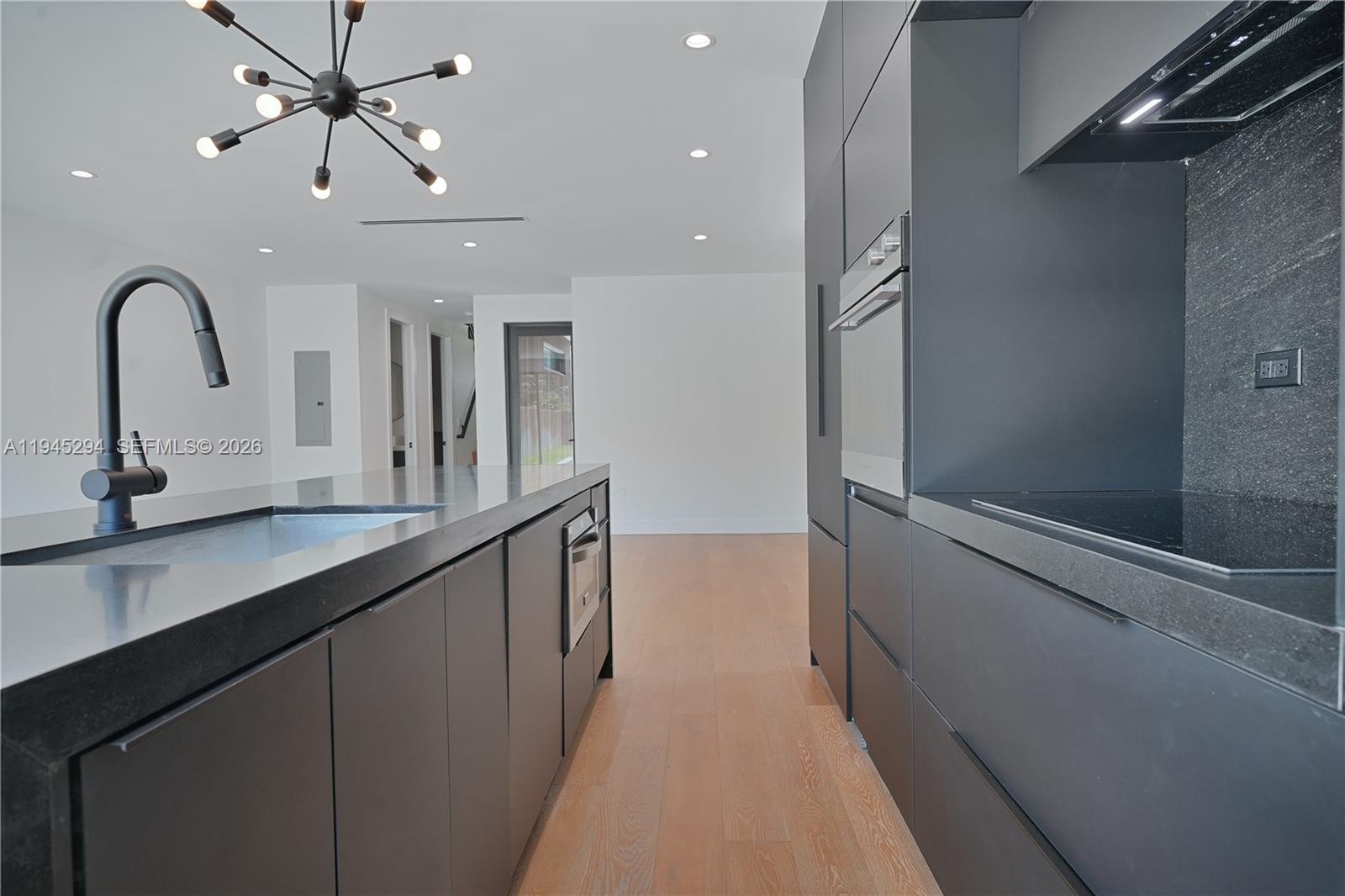 355 Northwest 50th Street Miami, FL 33127 - Photo 11 of 25 a view of a double vanity sink and a window