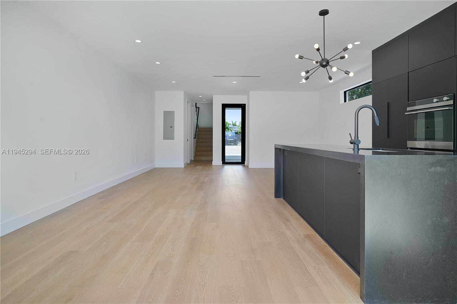 355 Northwest 50th Street Miami, FL 33127 - Photo 12 of 25 a view of a livingroom with a chandelier