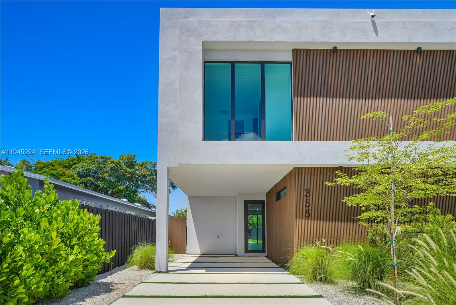 355 Northwest 50th Street Miami, FL 33127 - Photo 2 of 25 a front view of a house with a yard