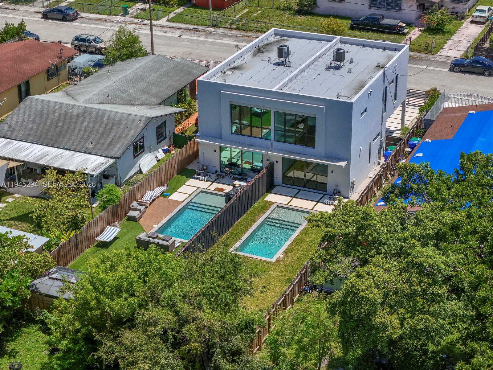355 Northwest 50th Street Miami, FL 33127 - Photo 4 of 25 an aerial view of a house with a yard