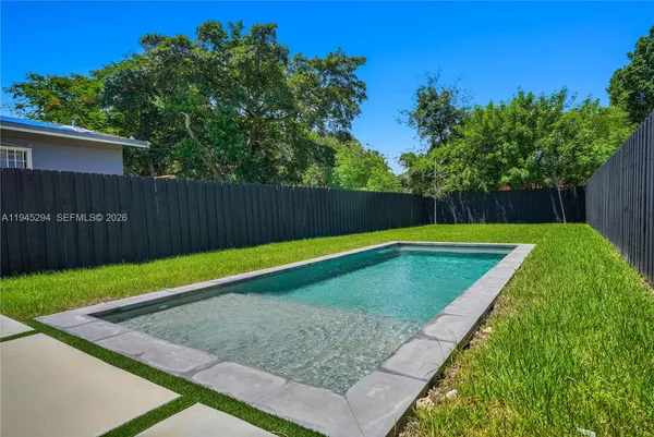 a view of a backyard with a small cabin
