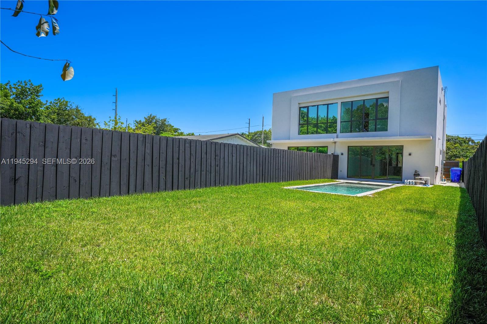 355 Northwest 50th Street Miami, FL 33127 - Photo 7 of 25 a view of house with backyard space and balcony