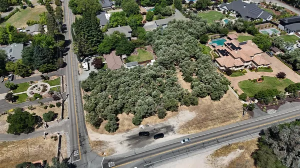 an aerial view of house with yard