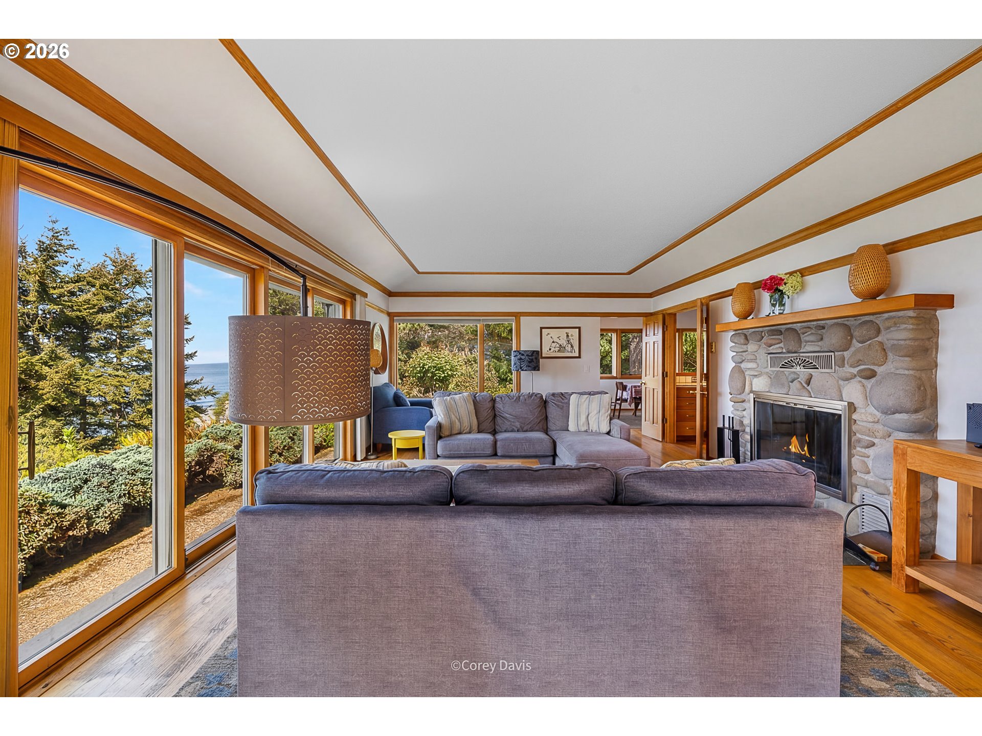 38295 Beulah Reed Road Nehalem, OR 97131 - Photo 12 of 42 a living room with fireplace furniture and a large window