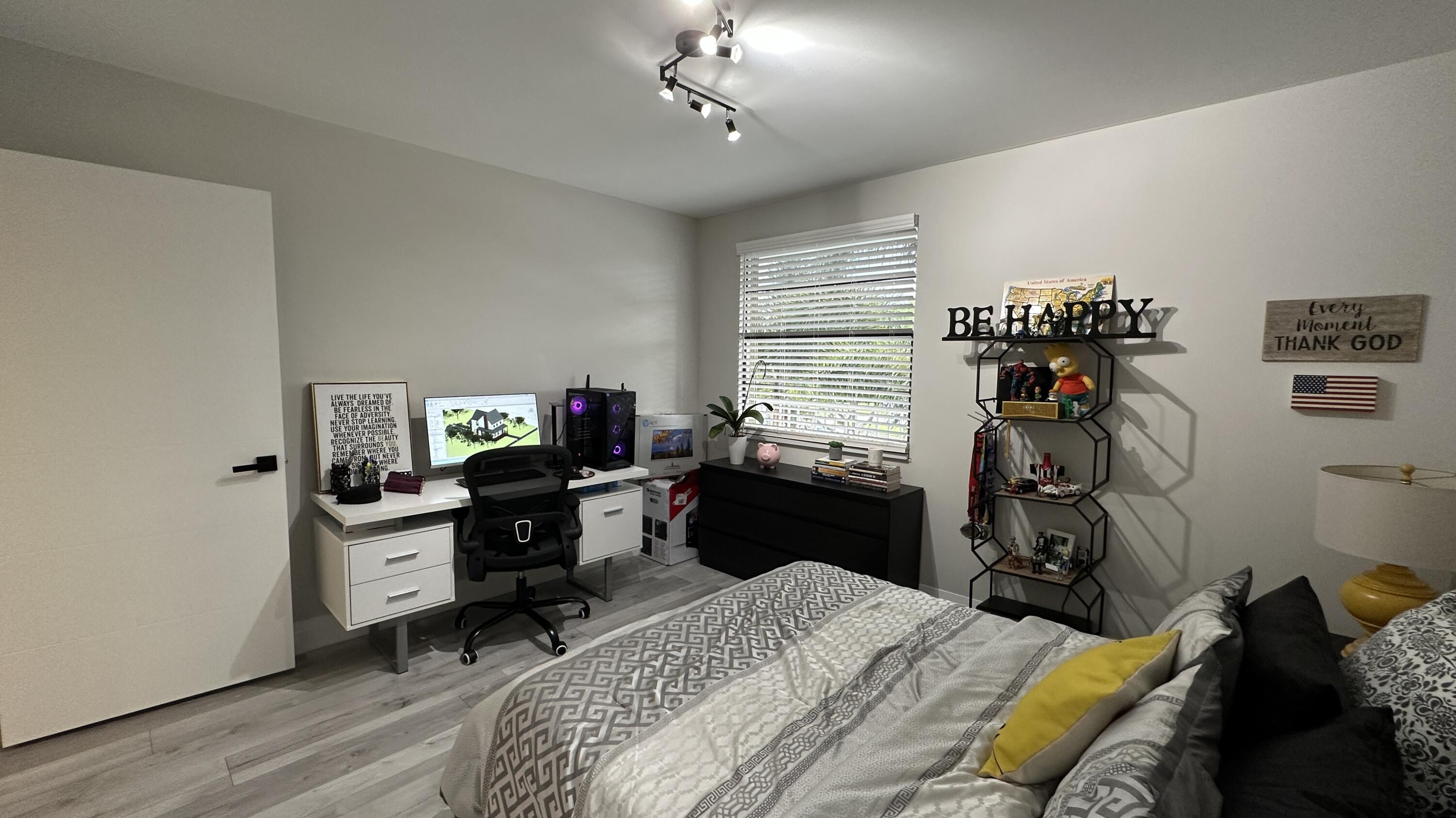 6073 Balboa Circle, Unit 305 Boca Raton, FL 33433 - Photo 12 of 29 a bedroom with a bed and a desk