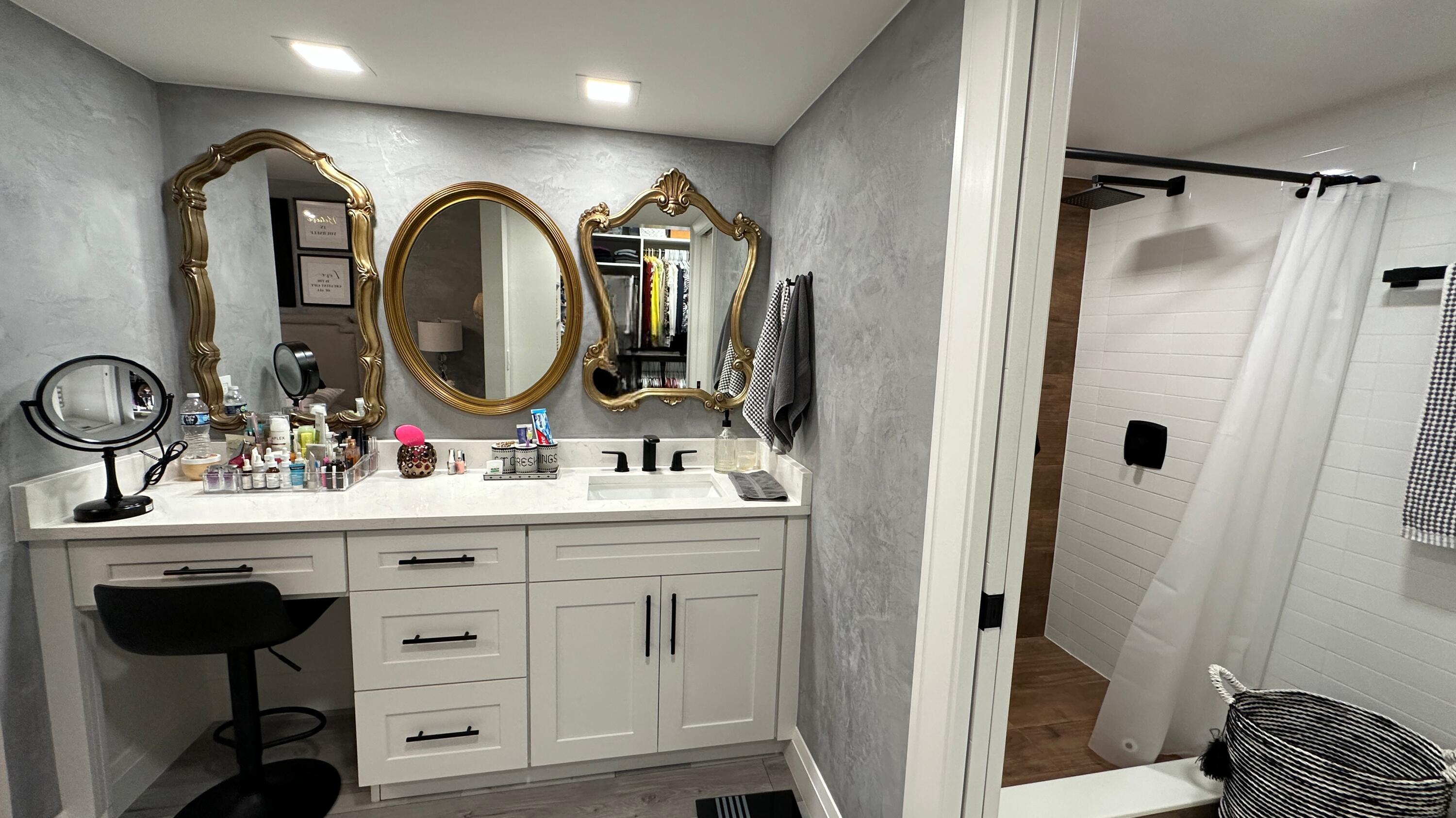 6073 Balboa Circle, Unit 305 Boca Raton, FL 33433 - Photo 17 of 29 a bathroom with a sink and a mirror