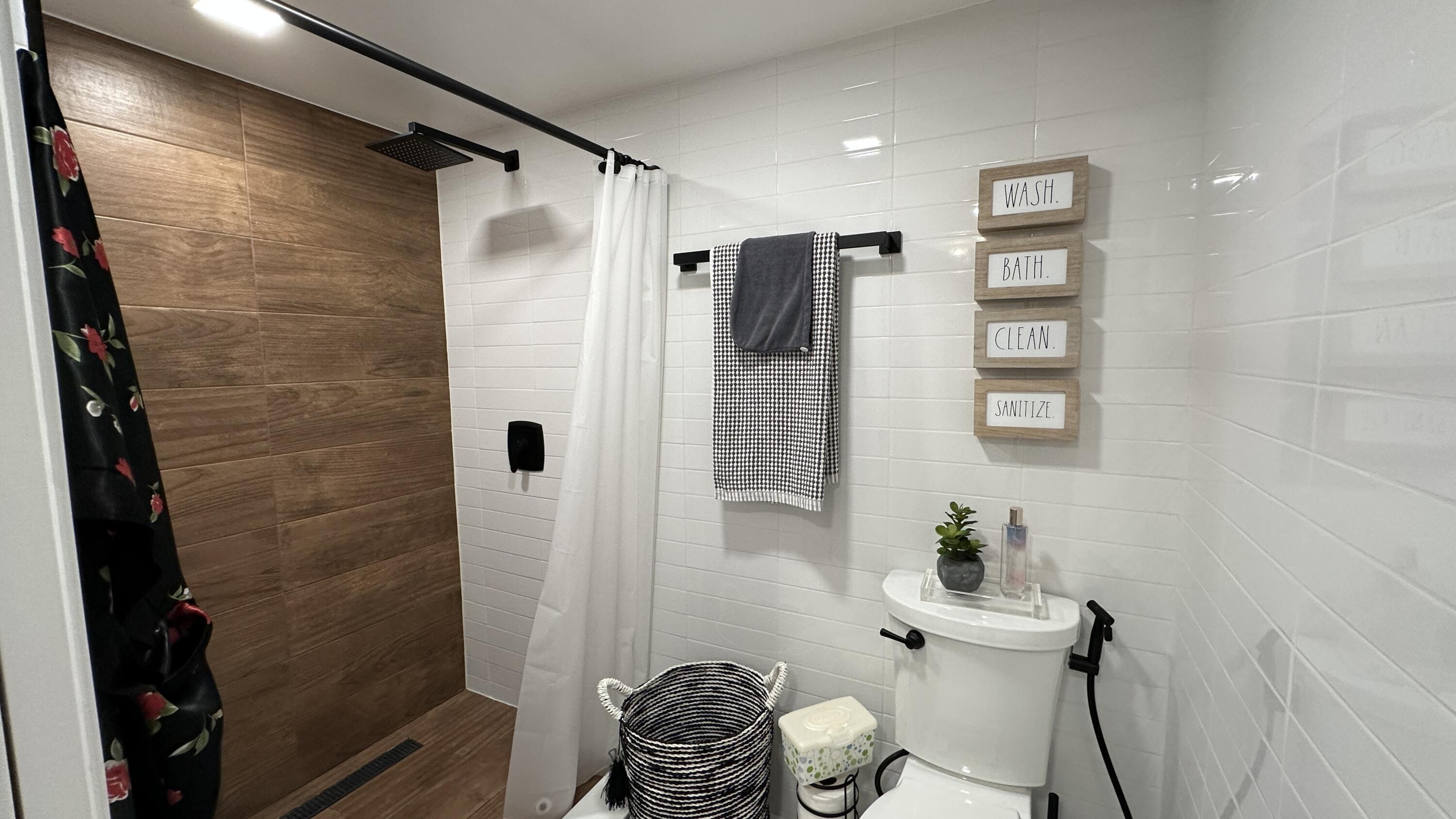 6073 Balboa Circle, Unit 305 Boca Raton, FL 33433 - Photo 18 of 29 a bathroom with a shower