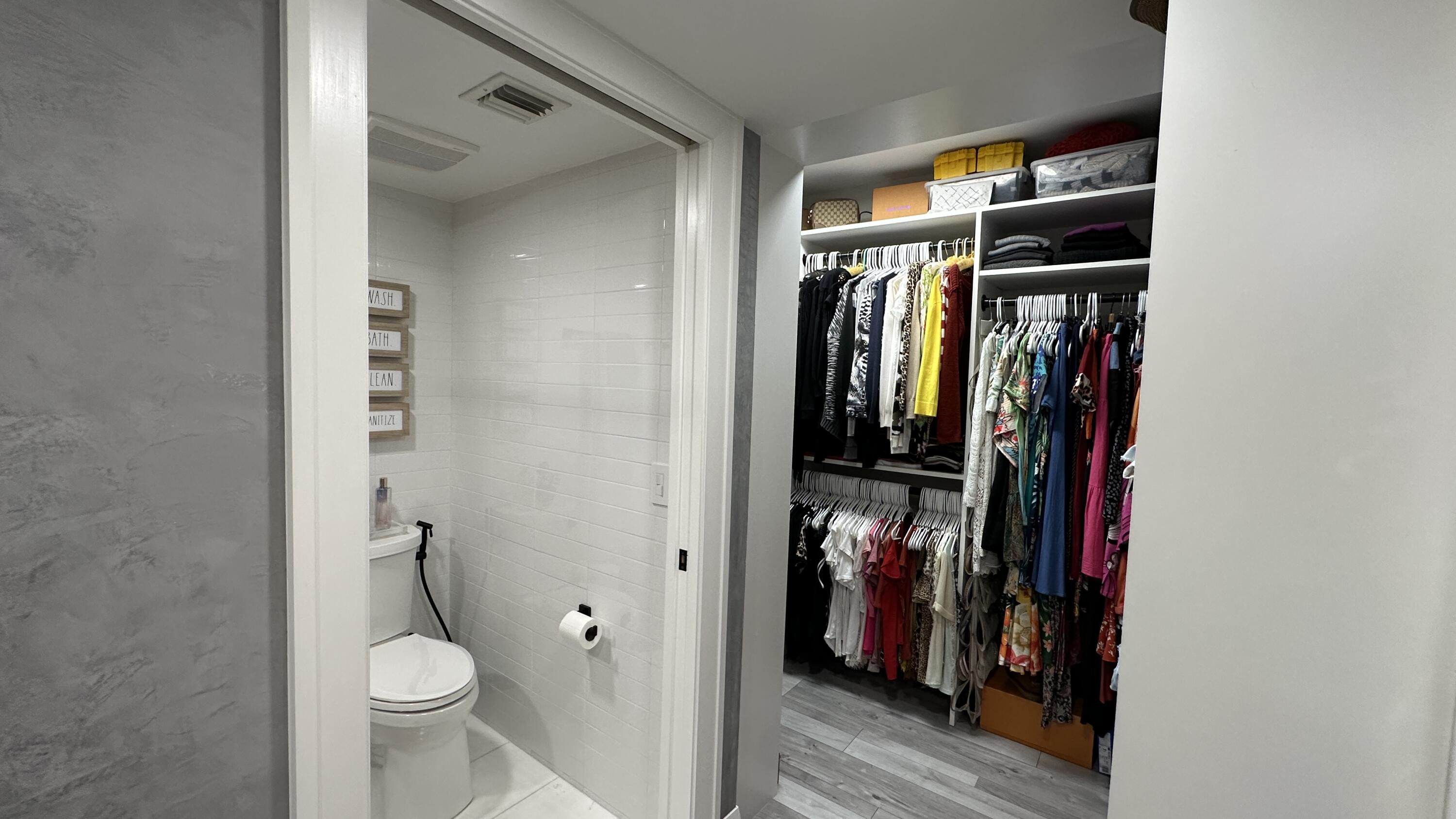 6073 Balboa Circle, Unit 305 Boca Raton, FL 33433 - Photo 19 of 29 a view of walk in closet with clothes and shoes