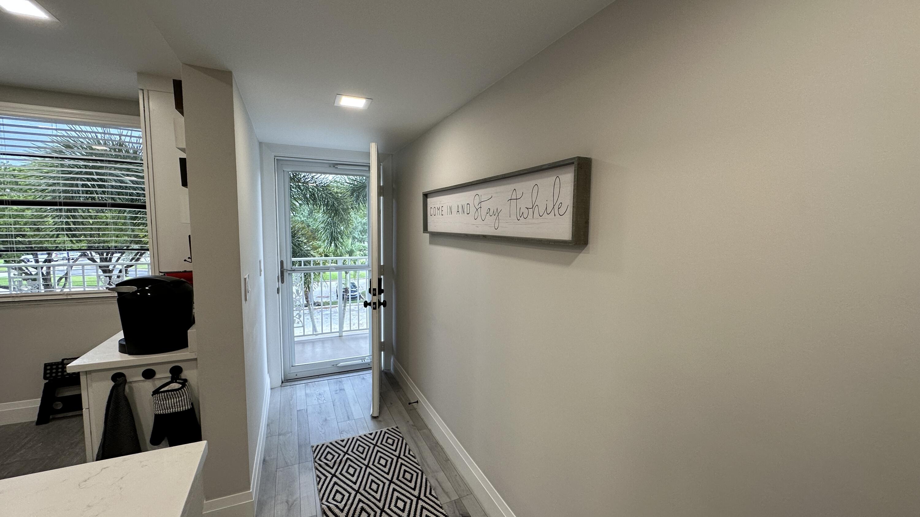 6073 Balboa Circle, Unit 305 Boca Raton, FL 33433 - Photo 2 of 29 a view of a workspace with furniture and a window