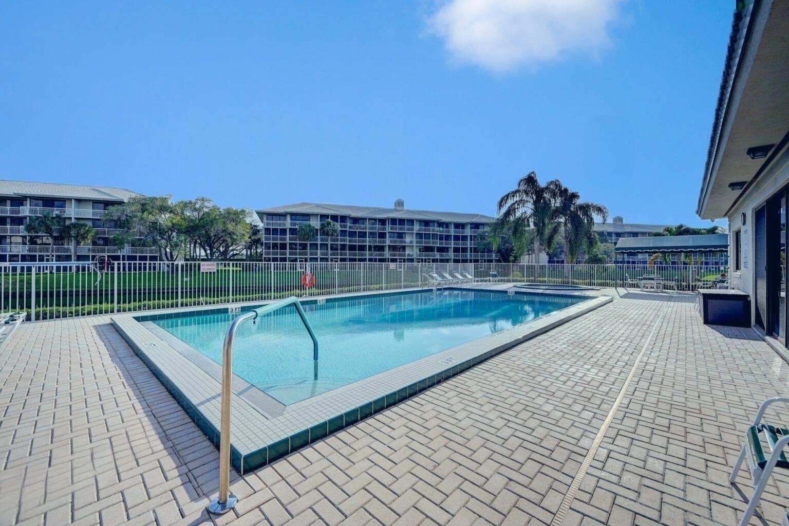 6073 Balboa Circle, Unit 305 Boca Raton, FL 33433 - Photo 23 of 29 a view of a swimming pool