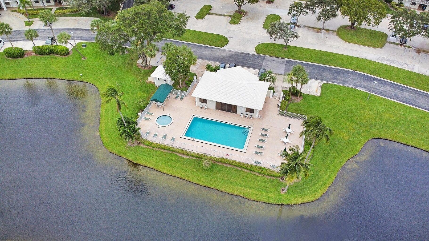 6073 Balboa Circle, Unit 305 Boca Raton, FL 33433 - Photo 25 of 29 an aerial view of a swimming pool