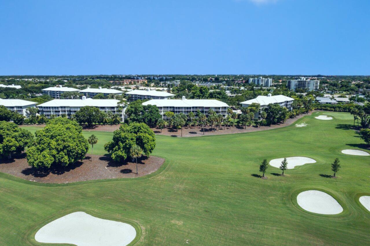 6073 Balboa Circle, Unit 305 Boca Raton, FL 33433 - Photo 27 of 29 a view of a golf course with chairs