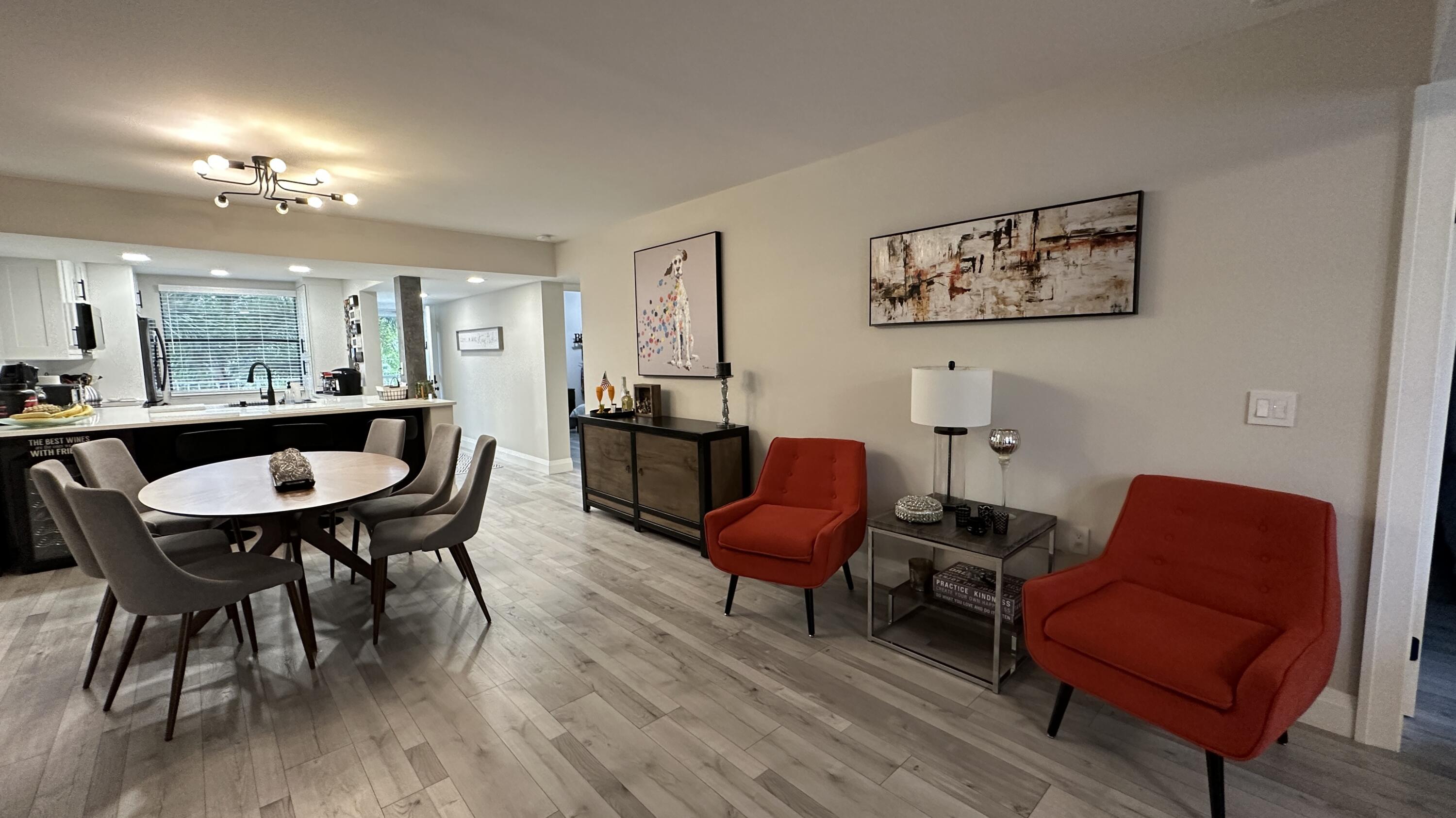 6073 Balboa Circle, Unit 305 Boca Raton, FL 33433 - Photo 6 of 29 a view of a dining room with furniture and wooden floor