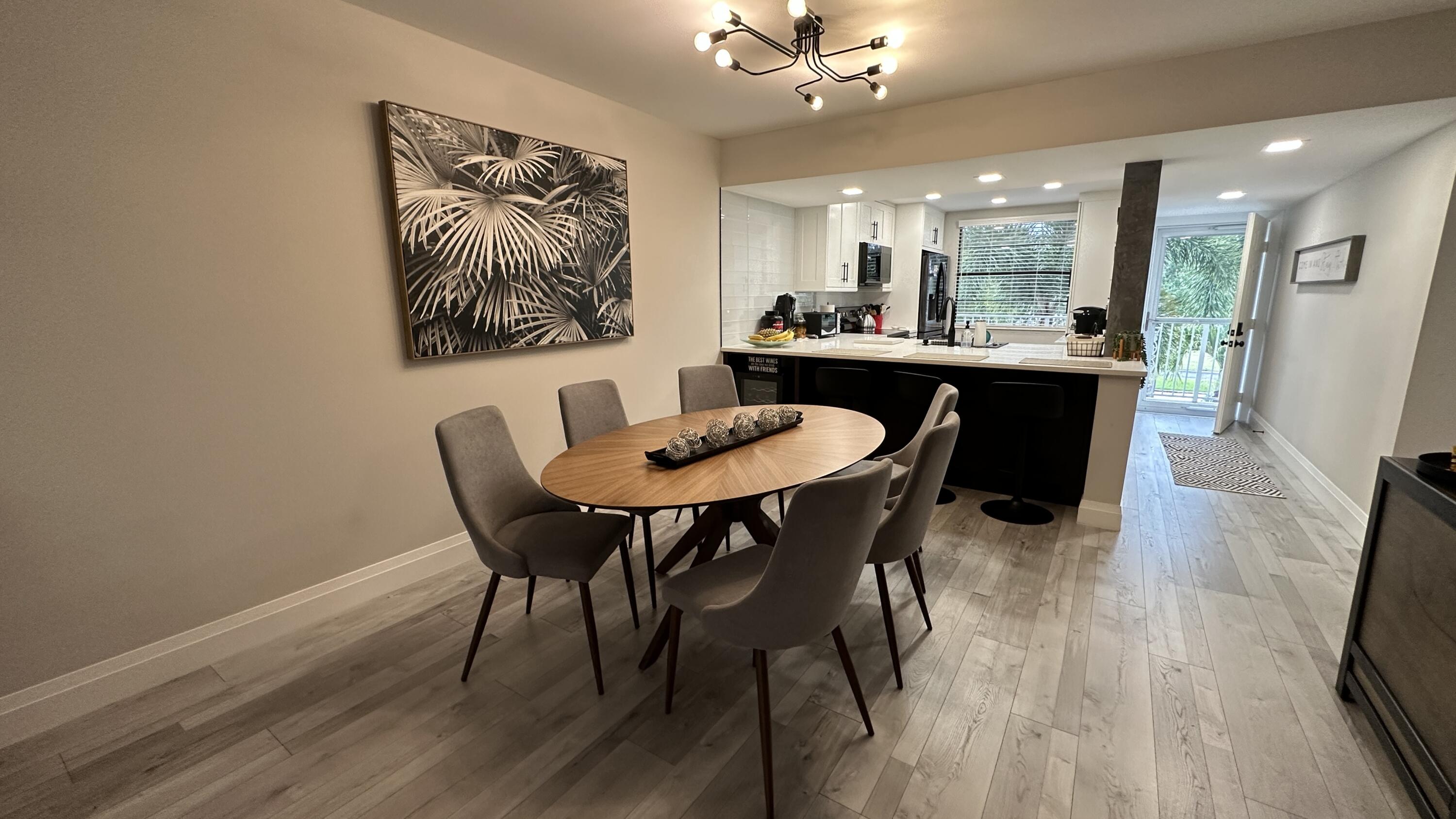 6073 Balboa Circle, Unit 305 Boca Raton, FL 33433 - Photo 7 of 29 a dining room with furniture and window
