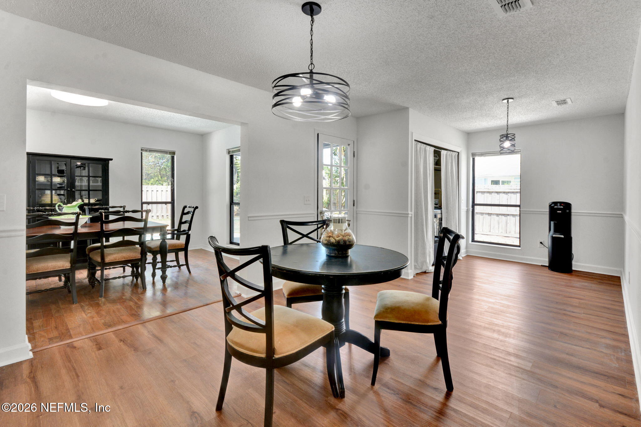 1074 Kings Road Neptune Beach, FL 32266 - Photo 9 of 31 a view of a dining room with furniture and wooden floor