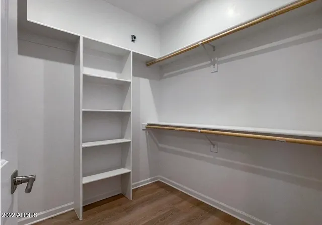 a view of an empty walk in closet