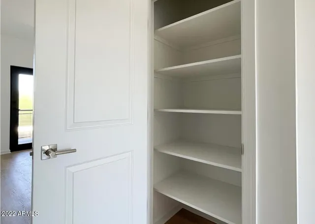 a view of staircase with wooden floor and stairs