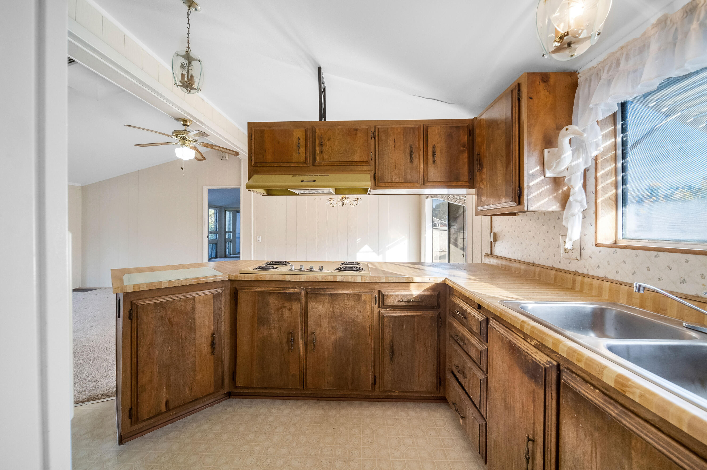 33440 Carlsbad Circle Thousand Palms, CA 92276 - Photo 19 of 52 a kitchen with a sink a stove and cabinets