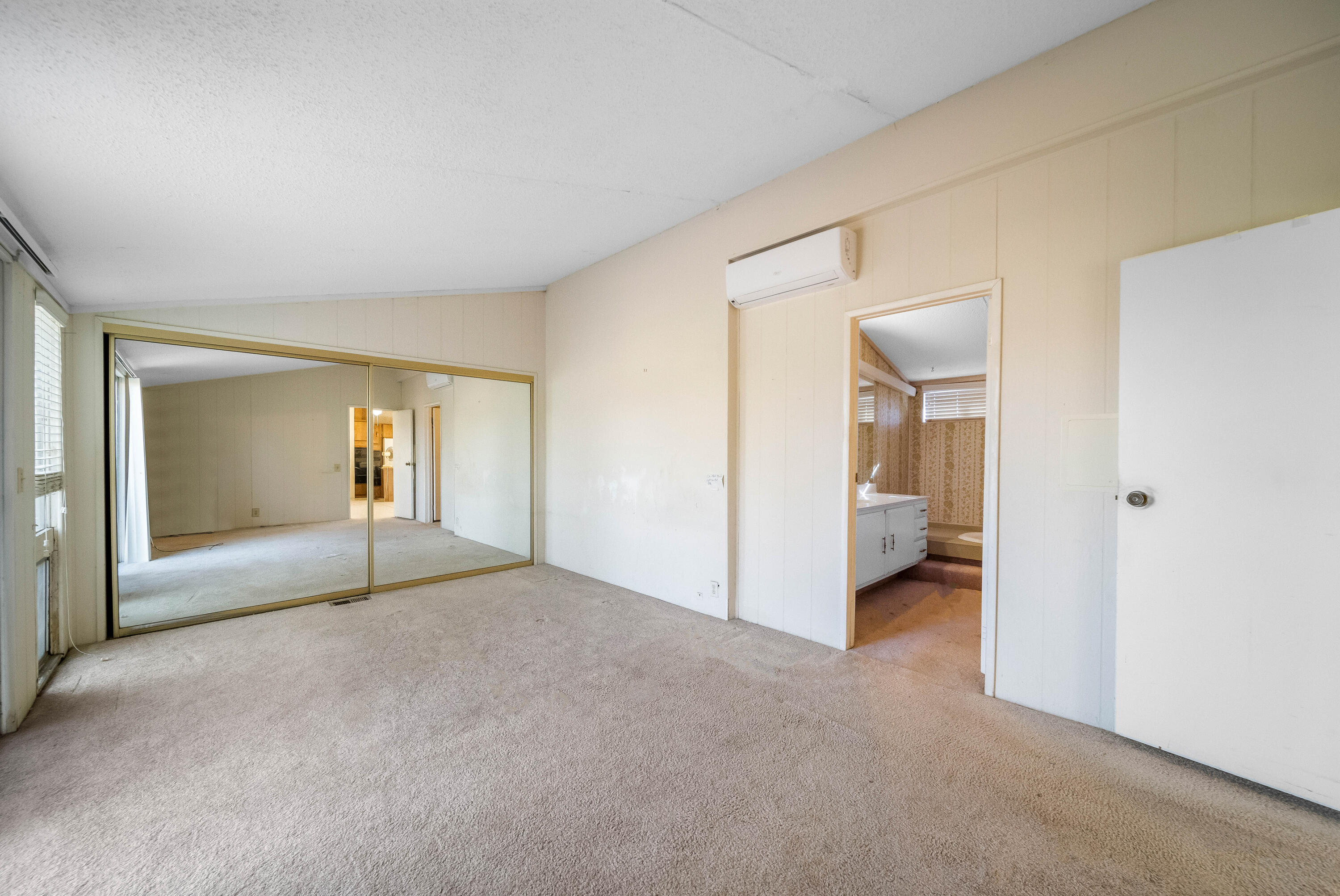 33440 Carlsbad Circle Thousand Palms, CA 92276 - Photo 22 of 52 a view of a room with an empty space and wooden floor