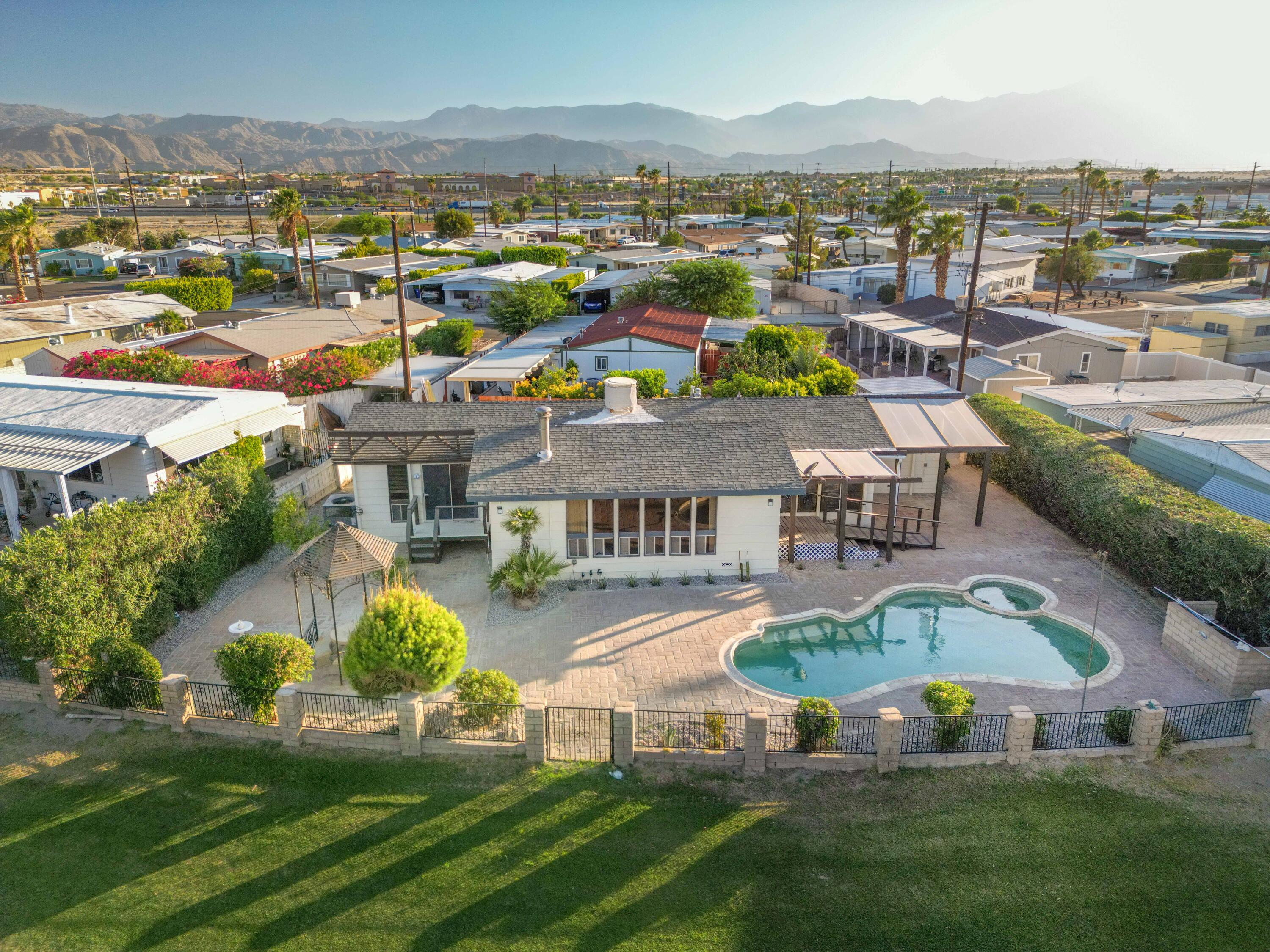 33440 Carlsbad Circle Thousand Palms, CA 92276 - Photo 32 of 52 an aerial view of residential houses with outdoor space and river view