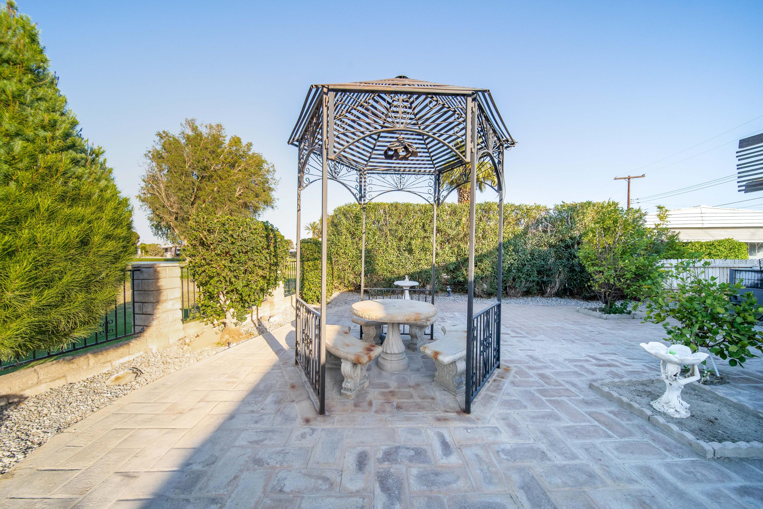 33440 Carlsbad Circle Thousand Palms, CA 92276 - Photo 38 of 52 a view of a chairs and table in the backyard