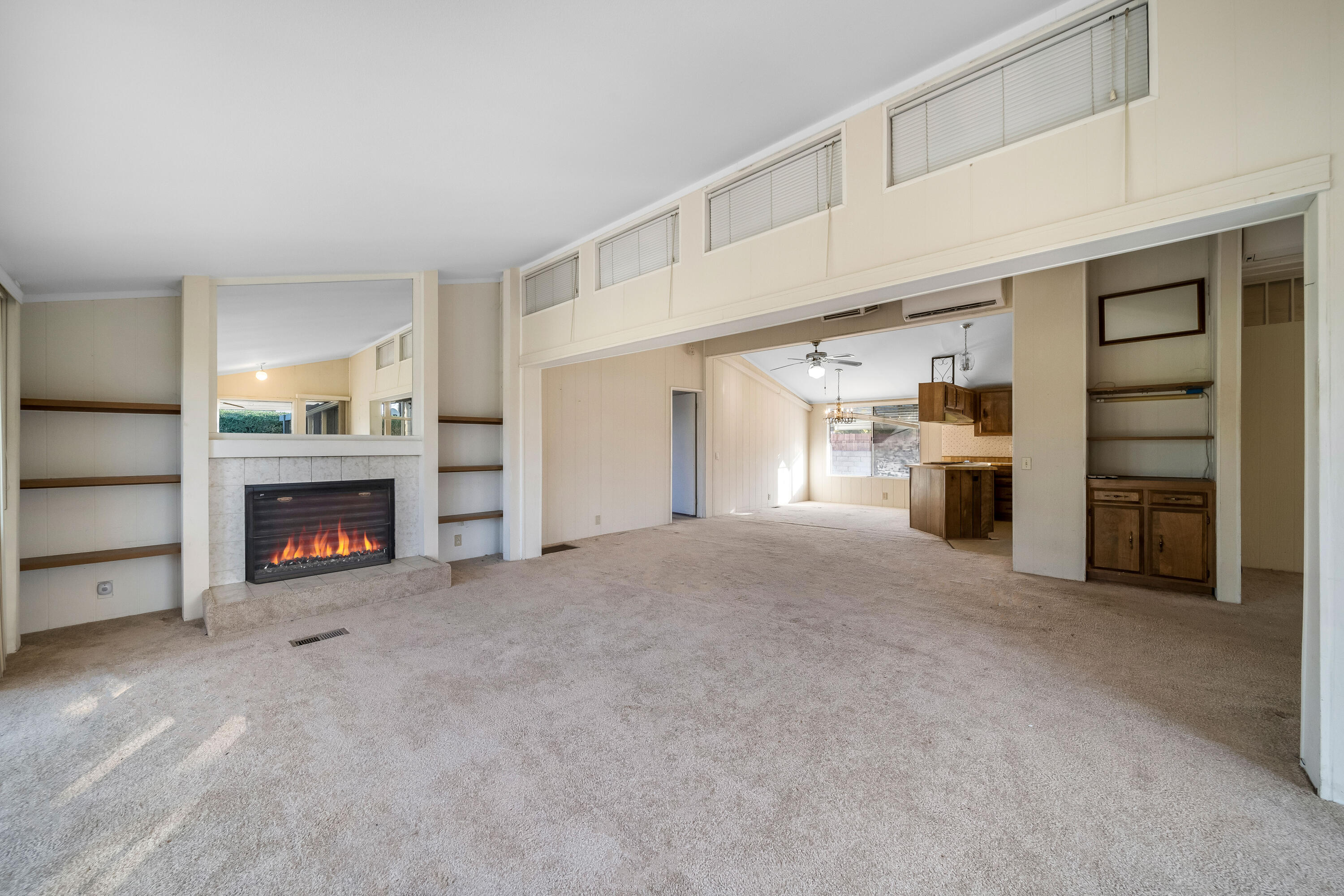 33440 Carlsbad Circle Thousand Palms, CA 92276 - Photo 4 of 52 a view of a livingroom with a fireplace cabinet and a window