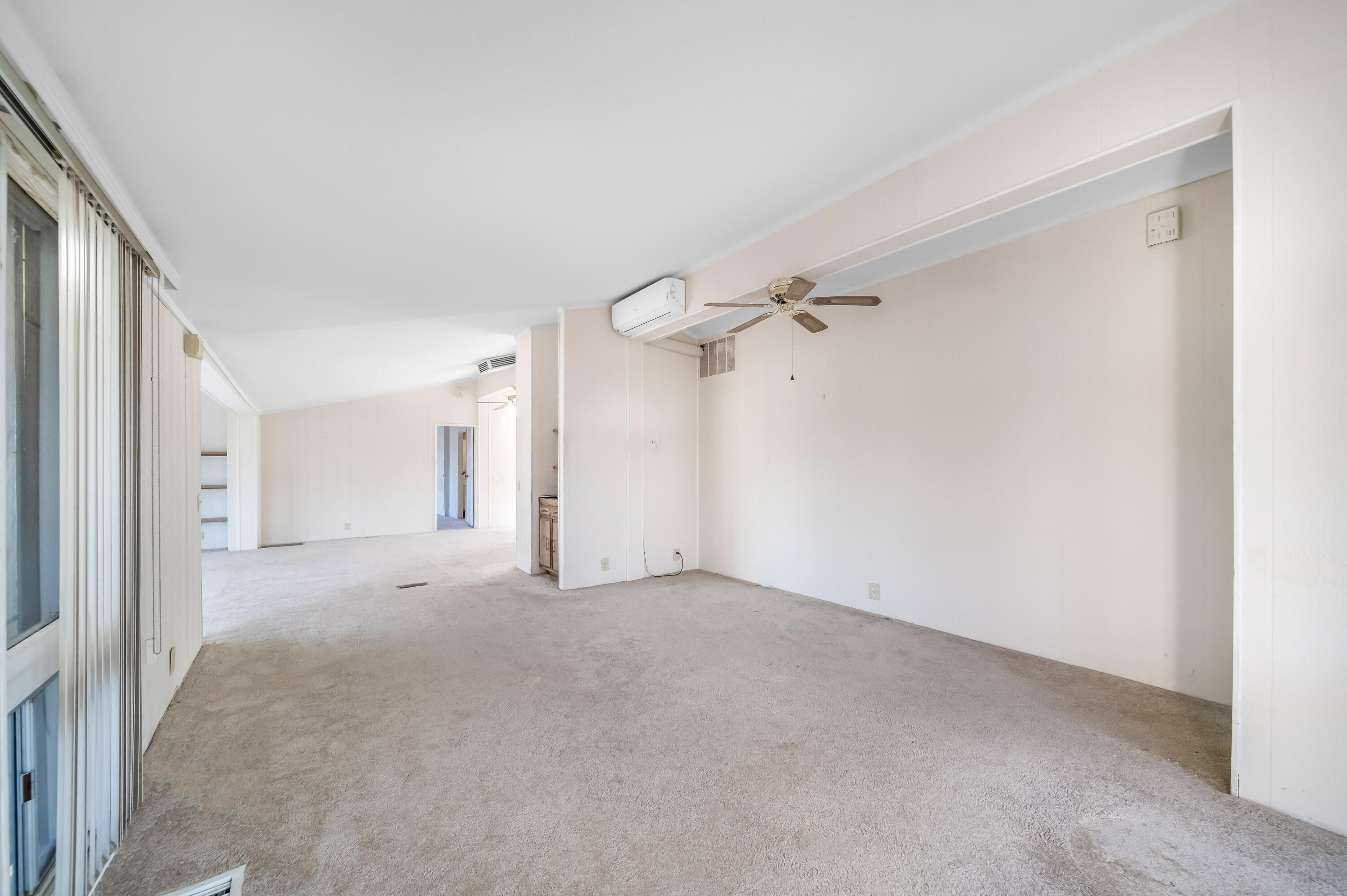 33440 Carlsbad Circle Thousand Palms, CA 92276 - Photo 7 of 52 a view of a big room with closet and a chandelier fan