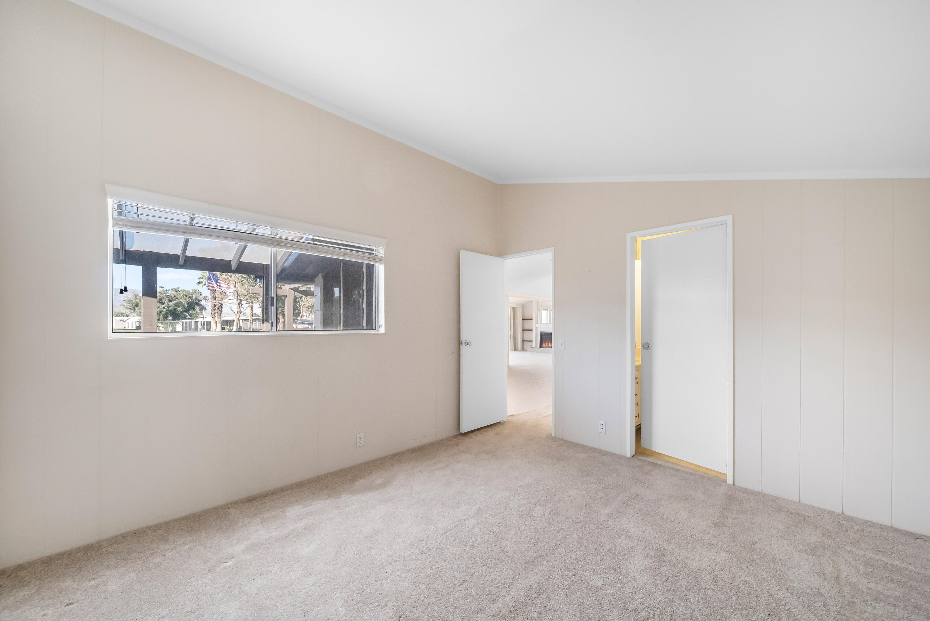 33440 Carlsbad Circle Thousand Palms, CA 92276 - Photo 9 of 52 a view of an empty room with a window