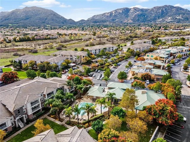 an aerial view of residential house and sandy dunes