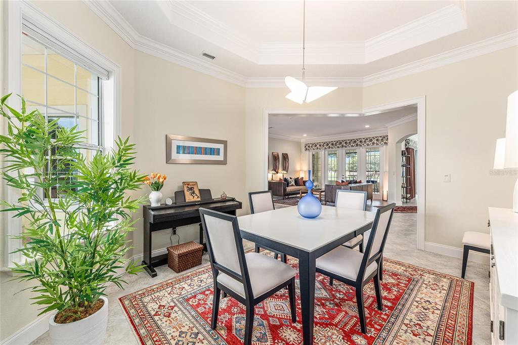 8671 Southwest 83rd Loop Ocala, FL 34481 - Photo 12 of 58 a view of a dining room with furniture window and wooden floor
